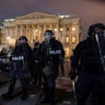 Authorities remove protesters from the U.S. Capitol, Wednesday, Jan. 6, 2021, in Washington.