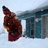 Tim Ahlman shovels snow outside his home in Bellemont, Ariz., Monday, Jan. 25, 2021. A series of winter storms has dropped more precipitation in Flagstaff than the city had during last summer's monsoon season. The recent snow measured as water topped the amount of rain that fell from mid-June through September, the driest monsoon season on record.