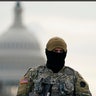 A National Guardsman stands at a roadblock outside the Capitol as security is ramped ahead of President-elect Joe Biden's inauguration ceremony Monday, Jan. 18, 2021, in Washington.