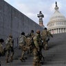 National Guard members take a staircase toward the U.S. Capitol building before a rehearsal for President-elect Joe Biden's Presidential Inauguration in Washington, Monday, Jan. 18, 2021.