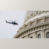 A U.S. Park Police helicopter circles the Capitol as a nearby fire prompted a temporary lockdown during a during a rehearsal for President-elect Joe Biden's inauguration ceremony, at the Capitol in Washington, Monday, Jan. 18, 2021.