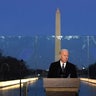 President-elect Joe Biden speaks during a COVID-19 memorial, with lights placed around the Lincoln Memorial Reflecting Pool, Tuesday, Jan. 19, 2021, in Washington.