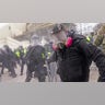 Trump supporters try to break through a police barrier, Wednesday, Jan. 6, 2021, at the Capitol in Washington. As Congress prepares to affirm President-elect Joe Biden's victory, thousands of people have gathered to show their support for President Trump and his claims of election fraud.