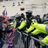 Trump supporters try to break through a police barrier, Wednesday, Jan. 6, 2021, at the Capitol in Washington. As Congress prepared to affirm President-elect Joe Biden's victory, thousands of people gathered to show their support for President Trump and his claims of election fraud.