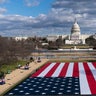 A large American flag is placed on the National Mall, with the U.S. Capitol behind, ahead of the inauguration of President-elect Joe Biden and Vice President-elect Kamala Harris, Monday, Jan. 18, 2021, in Washington.
