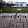 A ceremonial honor guard marches past the White House as members rehearse for the President-elect Joe Biden's inauguration ceremony, Monday, Jan. 18, 2021, in Washington.