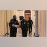 U.S. Capitol Police survey the corridor around the House of Representatives chamber after enhanced security protocols were enacted, including metal detectors for lawmakers, after a mob loyal to President Donald Trump stormed the Capitol, in Washington, Tuesday, Jan. 12, 2021.
