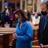 House Speaker Nancy Pelosi, left, and her husband Paul Pelosi attend Mass at the Cathedral of St. Matthew the Apostle during Inauguration Day ceremonies Wednesday, Jan. 20, 2021, in Washington. 