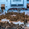 Hundreds of National Guard troops hold inside the Capitol Visitor's Center to reinforce security at the Capitol in Washington, Wednesday, Jan. 13, 2021. The House of Representatives is pursuing an article of impeachment against President Donald Trump for his role in inciting an angry mob to storm the Capitol last week. (AP Photo/J. Scott Applewhite