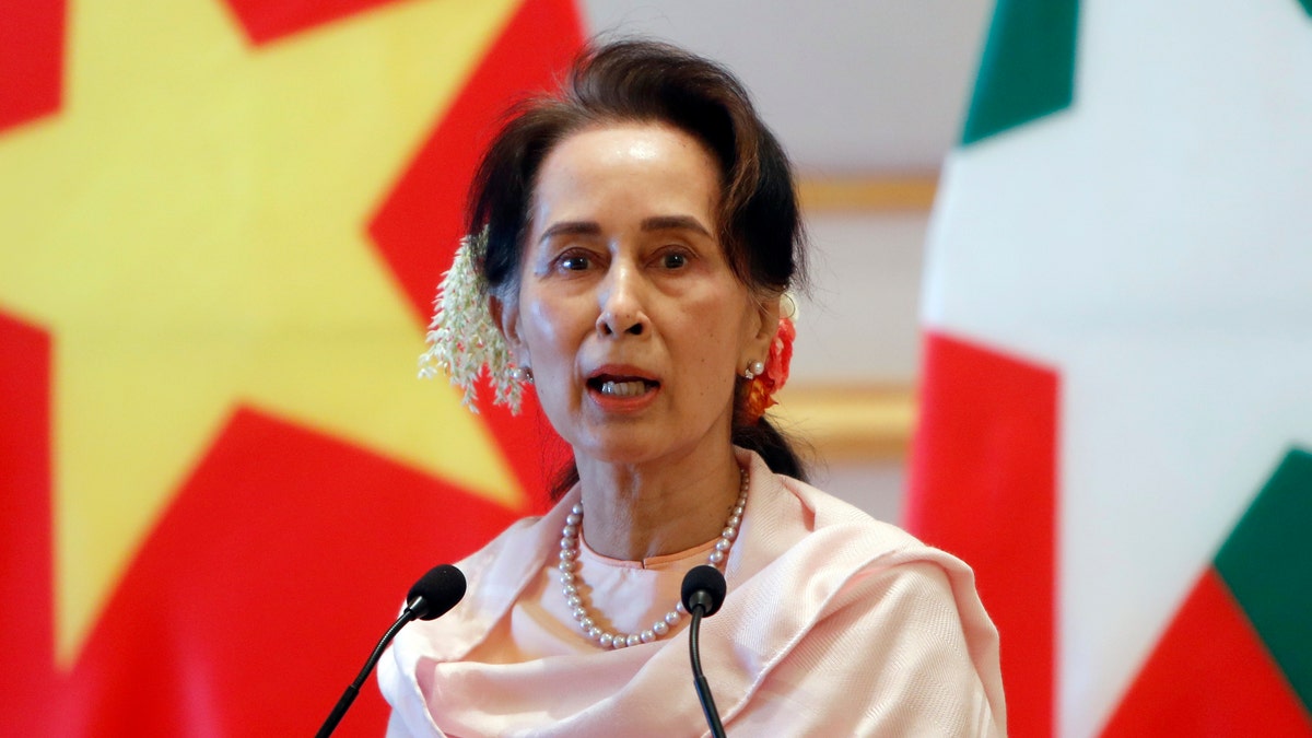 FILE - In this Dec. 17, 2019, file photo, Myanmar's leader Aung San Suu Kyi speaks during a joint press conference with Vietnam's Prime Minister Nguyen Xuan Phuc after their meeting at the Presidential Palace in Naypyitaw, Myanmar. Reports says Monday, Feb. 1, 2021 a military coup has taken place in Myanmar and Suu Kyi has been detained under house arrest. (AP Photo/Aung Shine Oo, File)