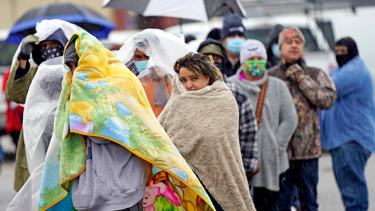 People wait in line to fill propane tanks Wednesday, Feb. 17, 2021, in Houston. (Associated Press)