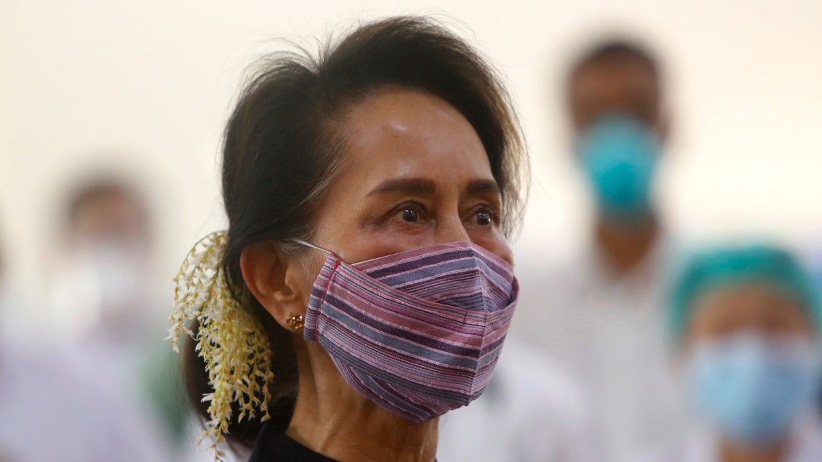FILE - In this Jan 27, 2021, file photo, Myanmar leader Aung San Suu Kyi watches the vaccination of health workers at hospital in Naypyitaw, Myanmar. Reports says Monday, Feb. 1, 2021 a military coup has taken place in Myanmar and Suu Kyi has been detained under house arrest. (AP Photo/Aung Shine Oo, File)