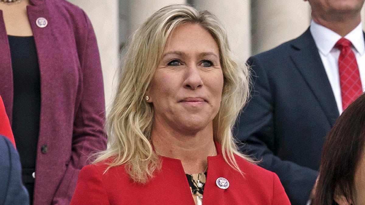 In this Jan. 4, 2021, photo, Rep. Marjorie Taylor Greene, R-Ga., center, stands with other GOP freshmen during an event at the Capitol in Washington. (AP Photo/J. Scott Applewhite)