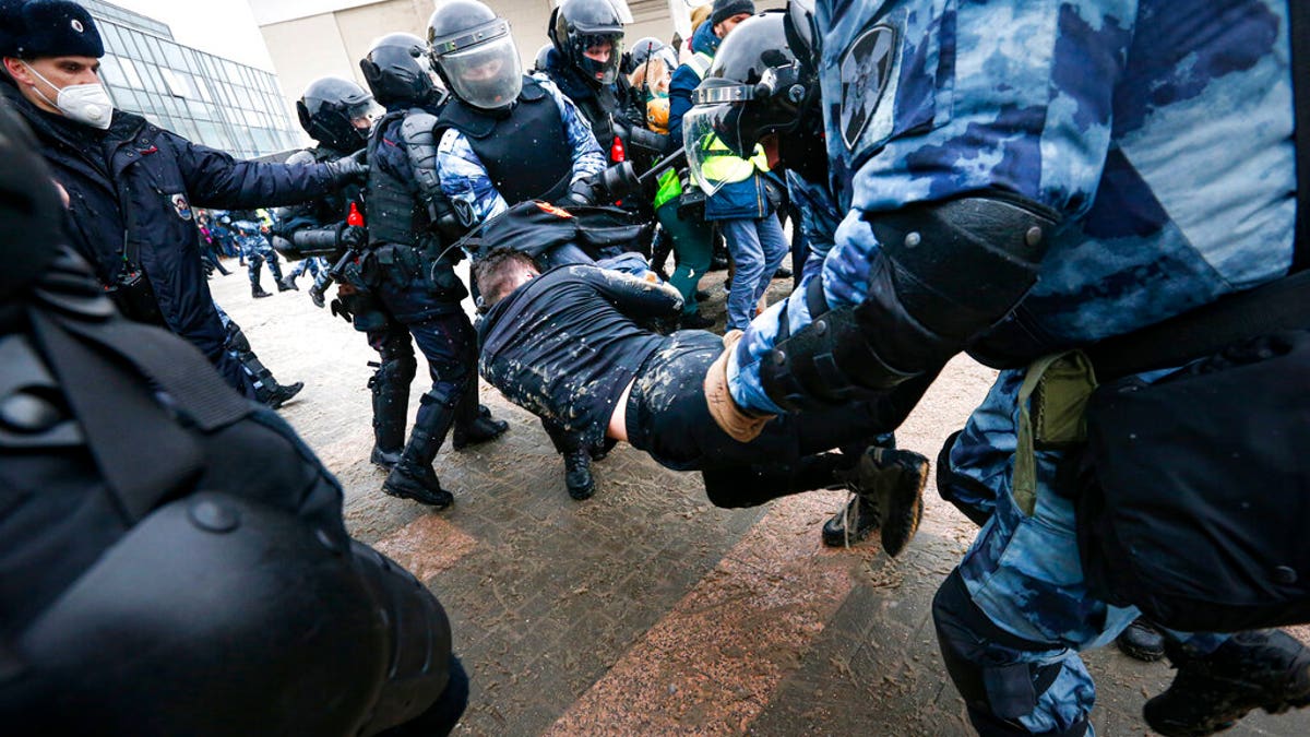 Police officers detain a man during a protest against the jailing of opposition leader Alexei Navalny in Moscow, Russia, on Jan. 31. (AP)