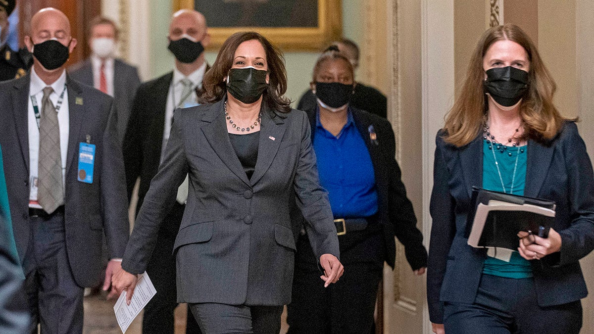 FILE: Vice President Kamala Harris arrives to hold mock swearing-in ceremonies for Senators in the Old Senate Chamber at the U.S. Capitol in Washington, Thursday, Feb. 4, 2021. (AP Photo/Andrew Harnik)