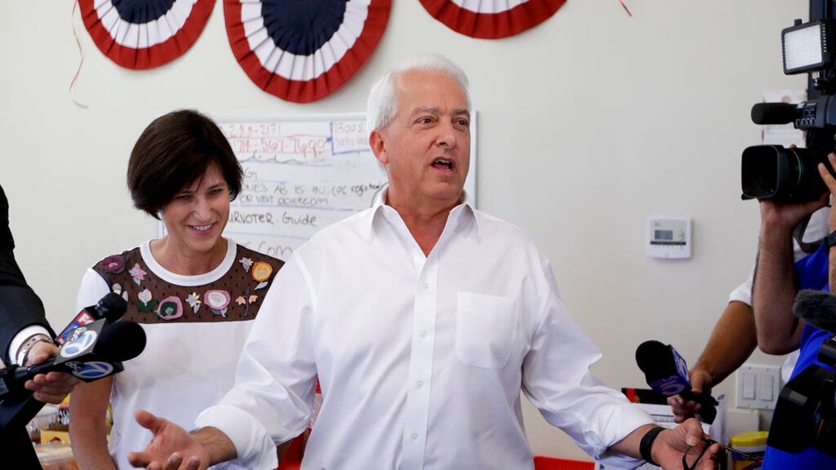 California Republican gubernatorial candidate John Cox speaks during campaign stop as Rep. Mimi Walters, R-Calif., looks on in Irvine, Calif. (AP Photo/Chris Carlson, File)