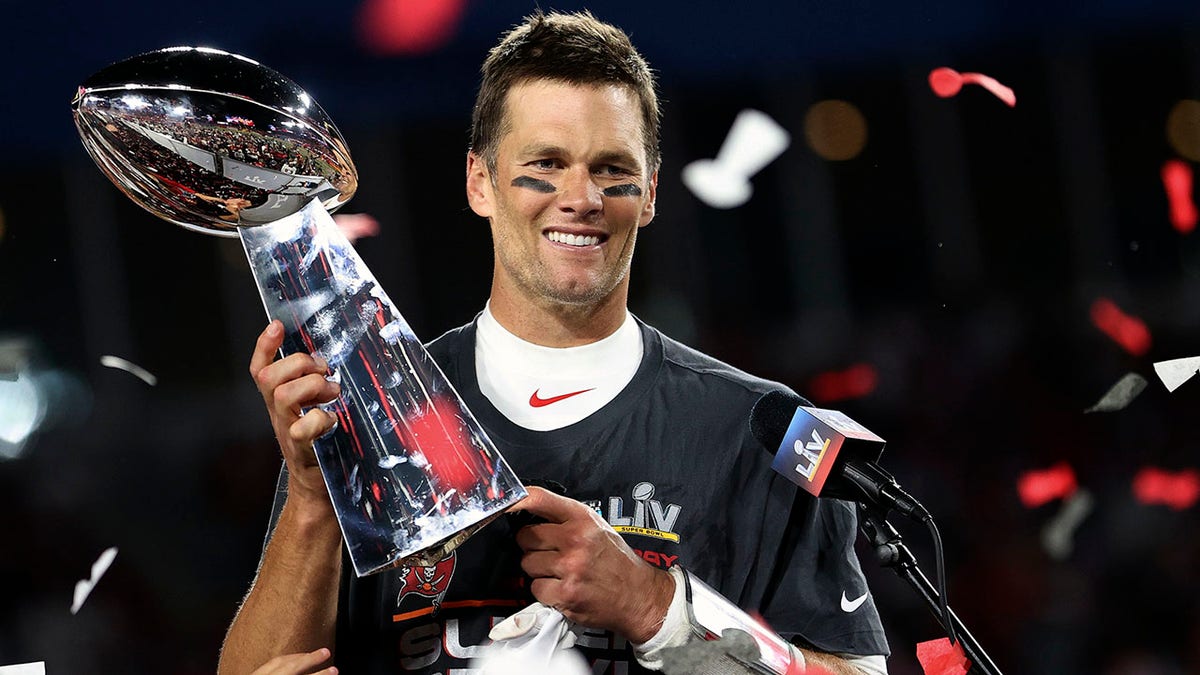 Tampa Bay Buccaneers quarterback Tom Brady (12) holds the Vince Lombardi trophy following the NFL Super Bowl 55 football game against the Kansas City Chiefs, Sunday, Feb. 7, 2021, in Tampa, Fla. Tampa Bay won 31-9.