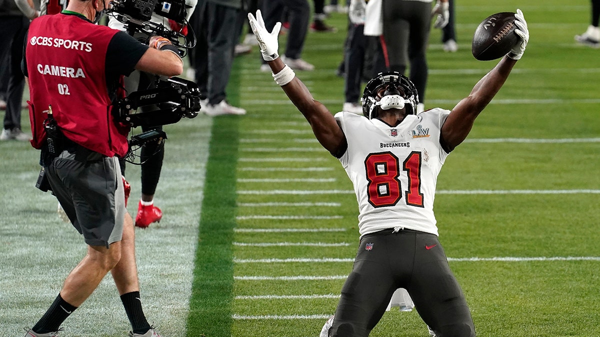 Tampa Bay Buccaneers wide receiver Antonio Brown celebrates after catching a 1-yard touchdown pass during the first half of the NFL Super Bowl 55 football game against the Kansas City Chiefs Sunday, Feb. 7, 2021, in Tampa, Florida.