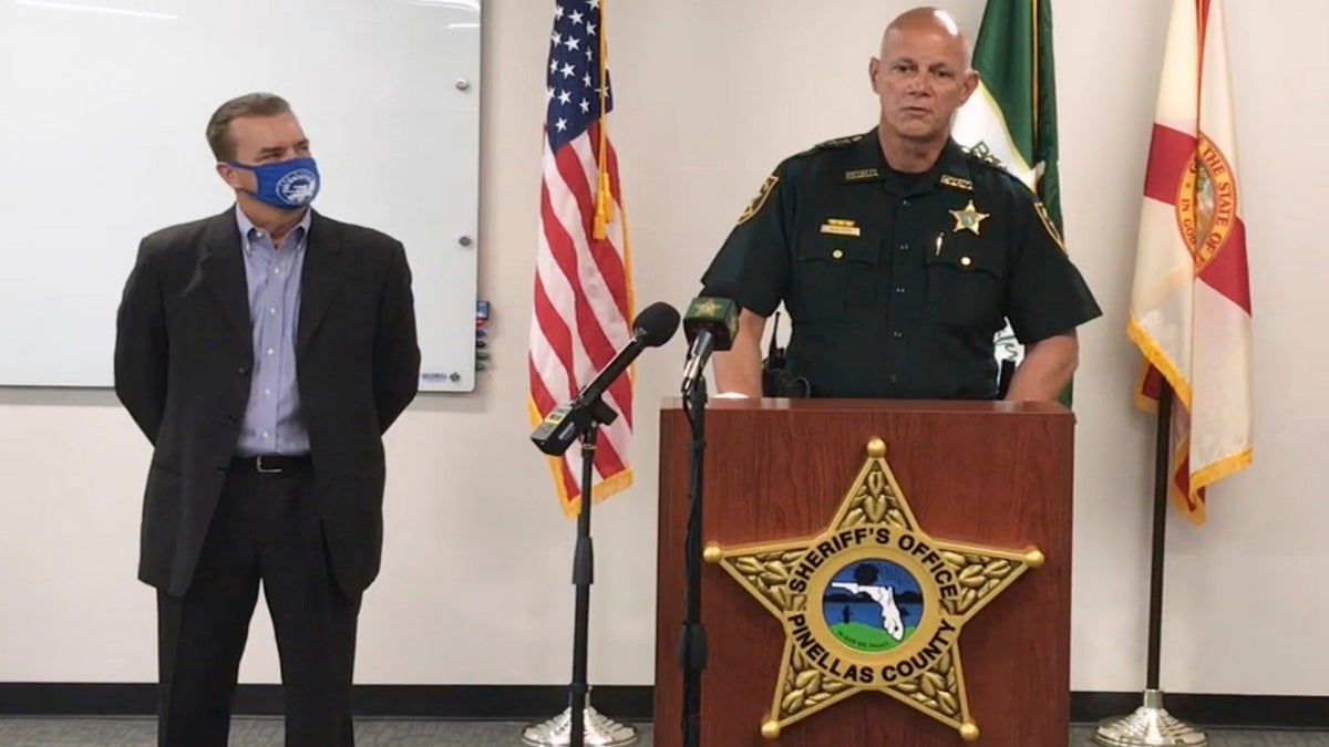 In this screen shot from a YouTube video posted by the Pinellas County Sheriff's Office, Pinellas County Sheriff Bob Gualtieri speaks during a news conference as Oldsmar, Fla., Mayor Eric Seidel, left, listens, Monday, Feb. 8, 2021, in Oldsmar, Fla. (Pinellas County Sheriff's Office via AP)