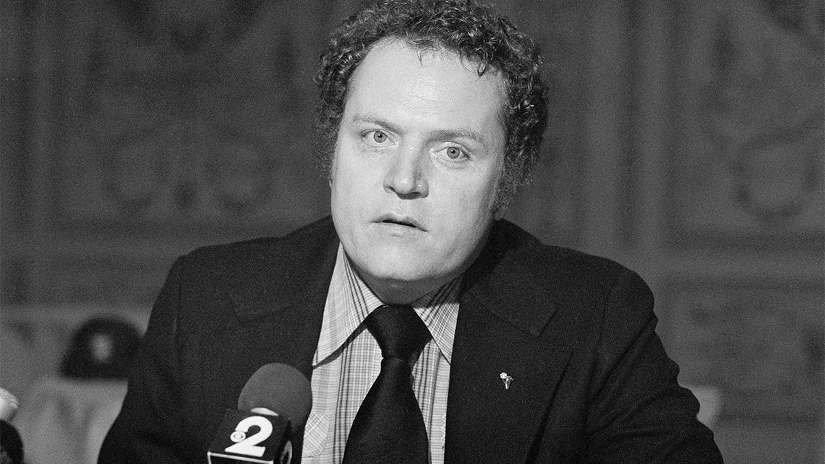 FILE - Hustler magazine publisher Larry Flynt reads his Christmas statement to the press on Dec. 18, 1977, in New York. (AP Photo/ Suzanne Vlamis, File)