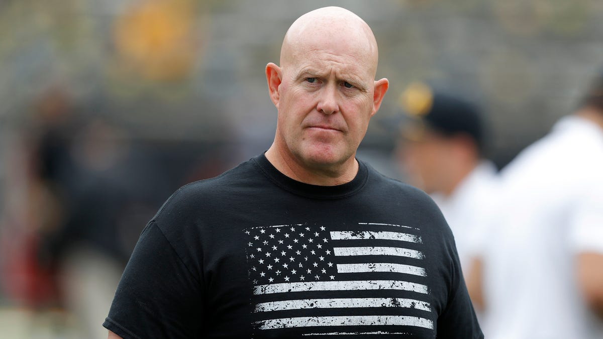 In this Sept. 1, 2018, file photo, Iowa strength and conditioning coach Chris Doyle walks on the field before an NCAA college football game between Iowa and Northern Illinois in Iowa City, Iowa. 