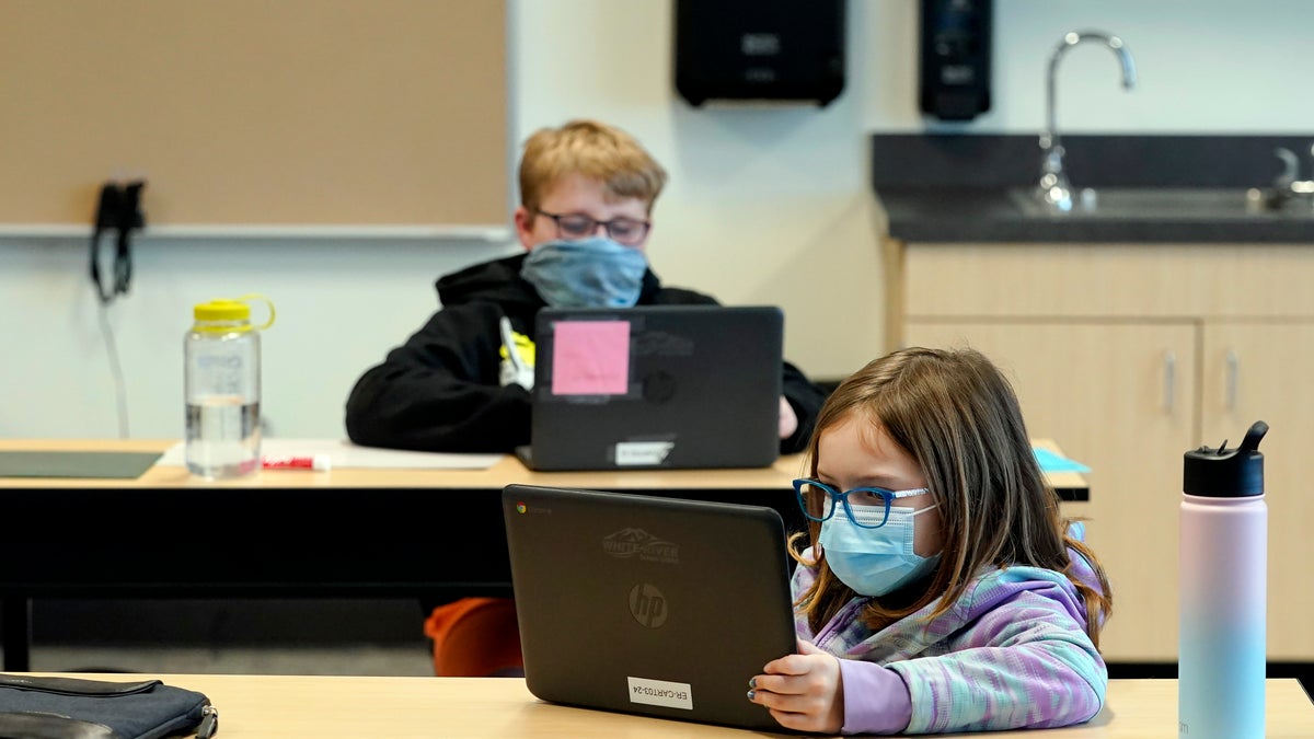 In this Feb. 2, 2021, file photo, students wear masks as they work in a fourth-grade classroom, at Elk Ridge Elementary School in Buckley, Wash. (AP Photo/Ted S. Warren, File)