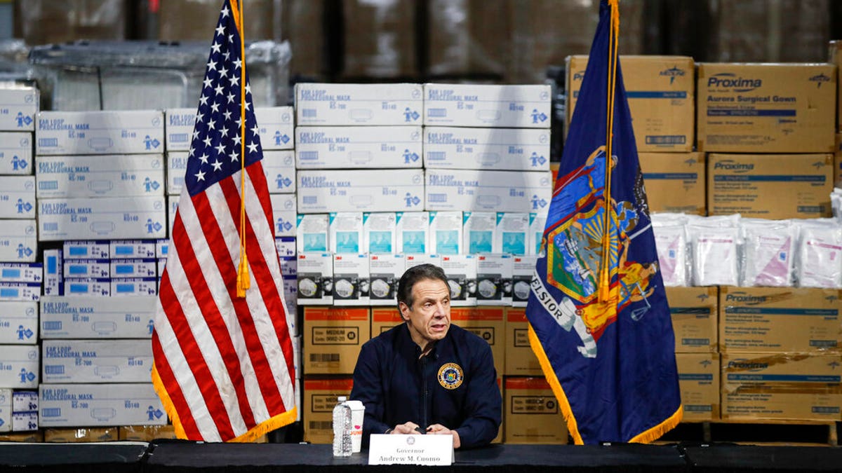 FILE: Gov. Andrew Cuomo speaks during a news conference against a backdrop of medical supplies at the Jacob Javits Center that will house a temporary hospital in response to the COVID-19 outbreak in New York. 