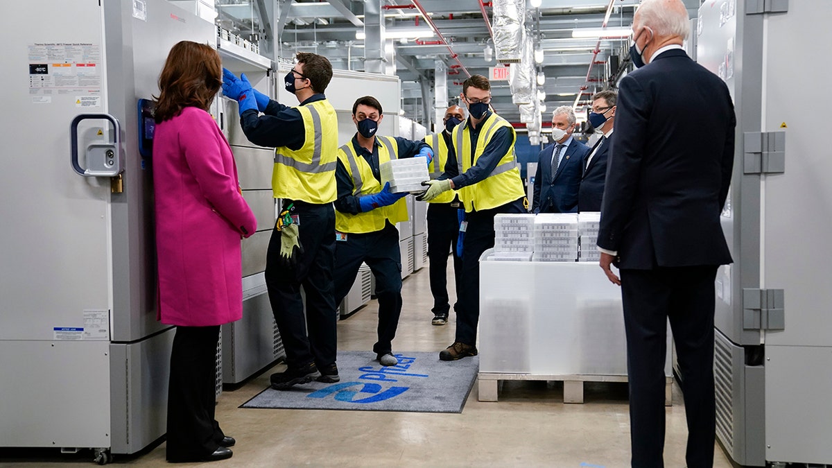 President Joe Biden, right, and Michigan Gov. Gretchen Whitmer, left, tour a Pfizer manufacturing site in Portage, Mich on Feb. 19, 2021. (AP Photo/Evan Vucci, File)