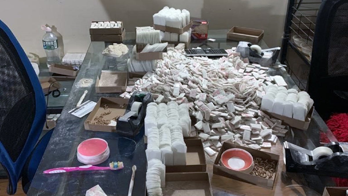 Photo provided by the DEA shows the heroin mill work table discovered in Queens, N.Y. on Feb. 8, 2021 (DEA)