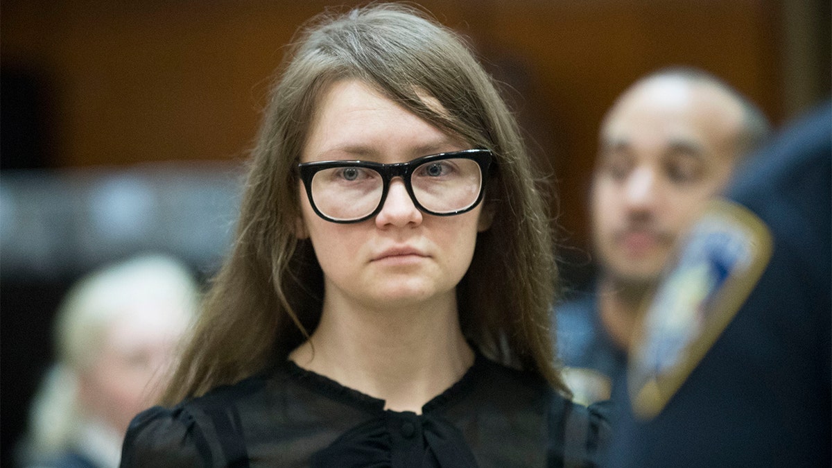 Anna Sorokin wearing her signature black-frame glasses at trial