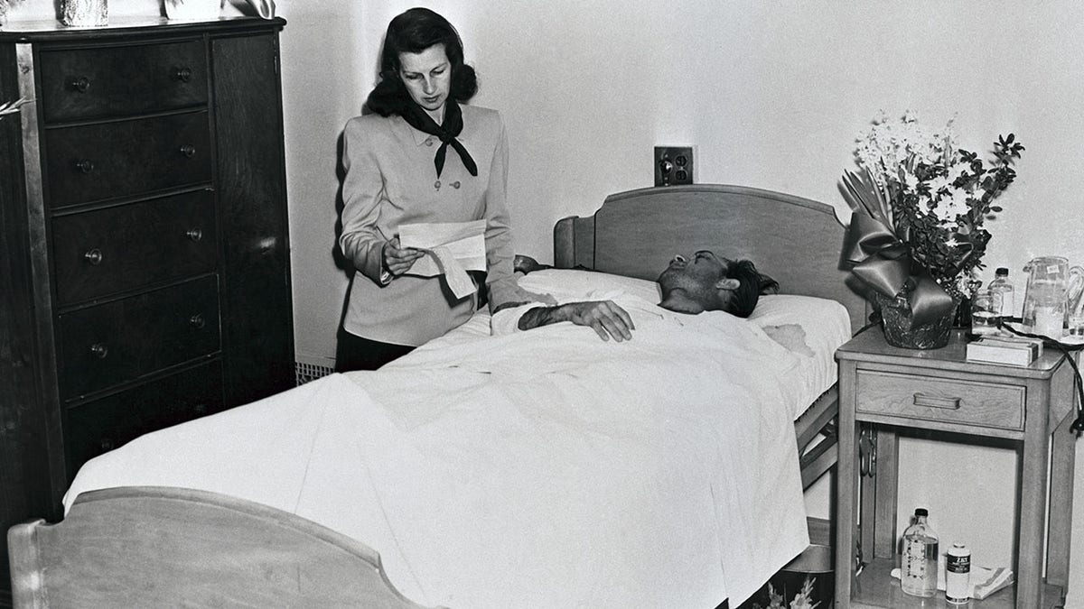 Ben Hogan recuperates from an auto accident.