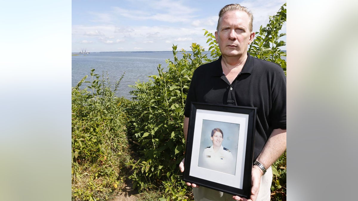 Bill Thomas, a producer on Oxygen's 'Lovers' Lane Murders' is seen here with a portrait of his sister Cathy Thomas.