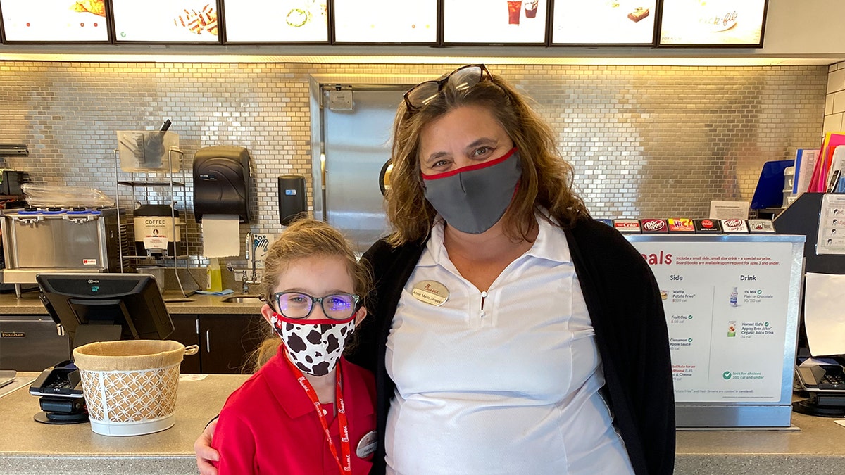 Anne Marie Stopper, right, invited Harper to be an honorary employee at the Chick-fil-A location she manages with her family.