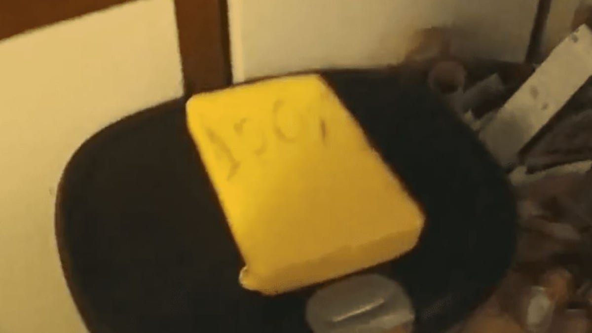 The suspicious package containing a kilo of cocaine was encased in yellow rubber with "100%" written on the outside, police said.
