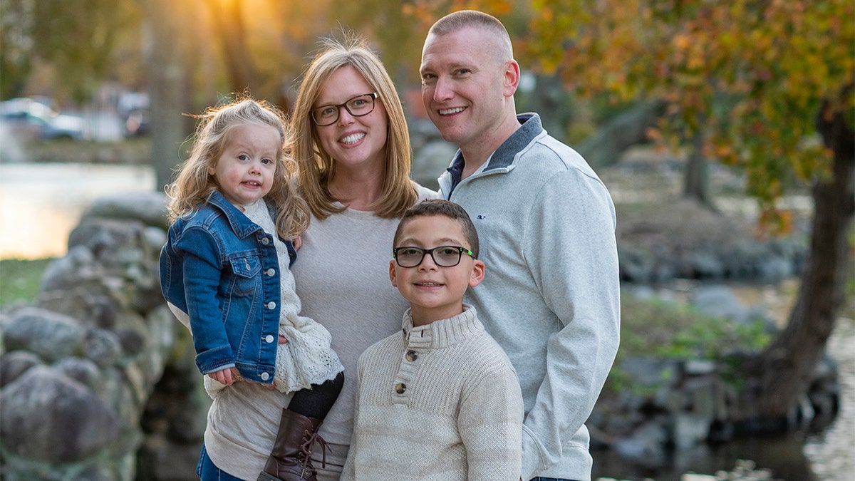 Kennedy Dorfman, left, her mother Aly, father Eric and older brother Cody