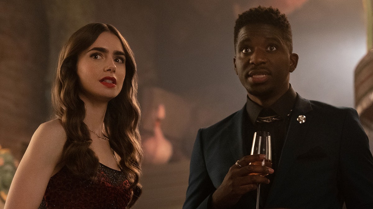 Lily Collins, left, and Samuel Arnold are seen in an episode of "Emily in Paris." (Netflix) 