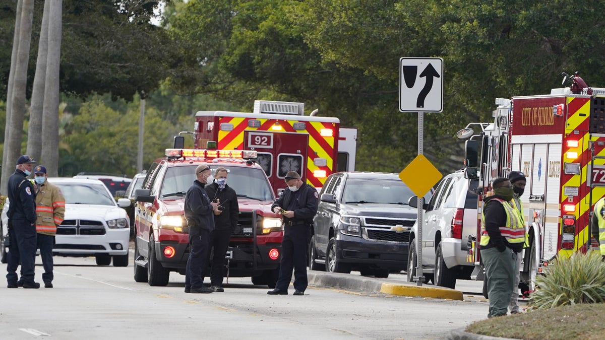 Law enforcement officers block an area where a shooting wounded several FBI while serving an arrest warrant, Tuesday, Feb. 2, 2021, in Sunrise, Fla. (AP Photo/Marta Lavandier)