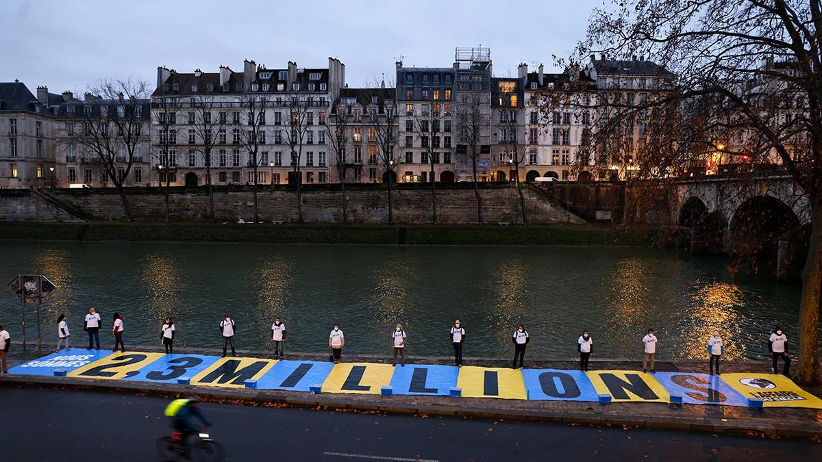 Environmental activists stage a protest in Paris in January before the first hearing in the case against the French state over climate inaction.