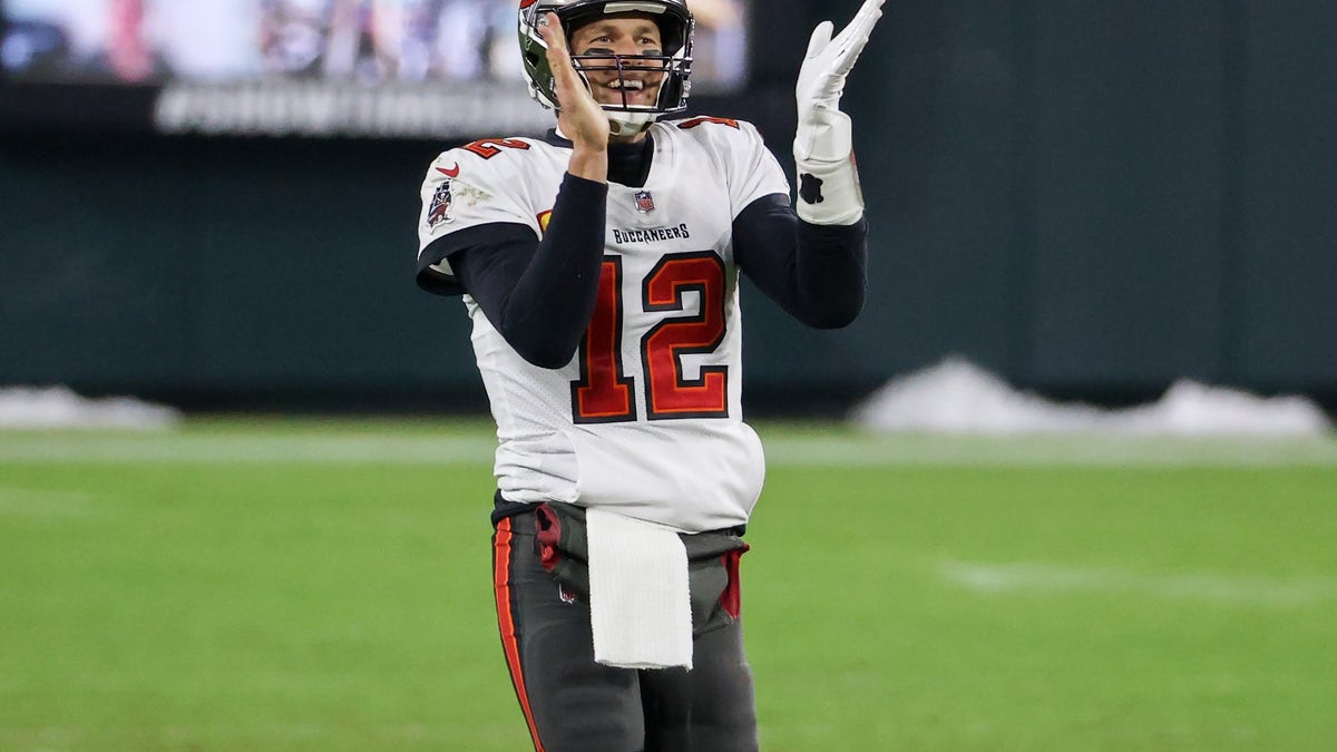Tom Brady of the Tampa Bay Buccaneers celebrates in the fourth quarter against the Green Bay Packers during the NFC Championship game at Lambeau Field on January 24, 2021, in Green Bay, Wisconsin. (Dylan Buell/Getty Images)