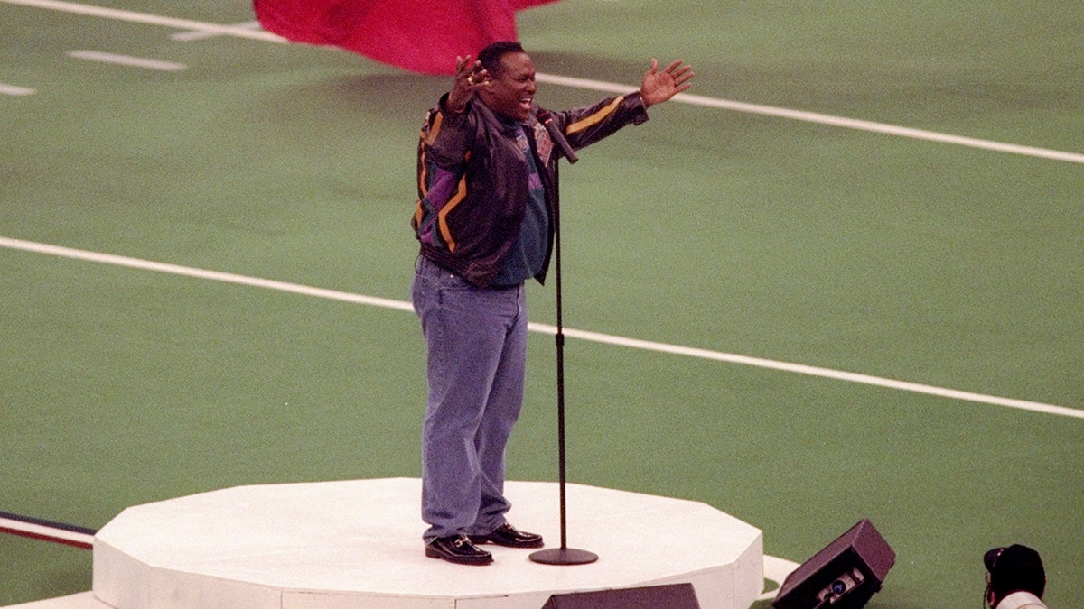 Luther Vandross captivated the audience at the Mercedes-Benz Superdome with his soulful performance of the national anthem at Super Bowl XXXI.