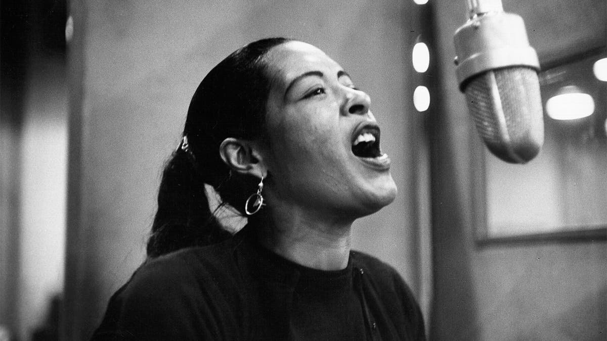 Singer Billie Holiday is pictured here recording her album 'Lady in Satin' at the Columbia Records studio in December 1957. (Photo by Michael Ochs Archives/Getty Images)