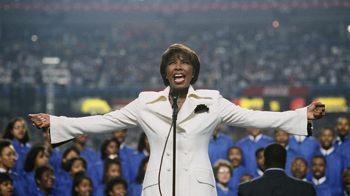 Natalie Cole captivated her audience with her gospel rendition of the national anthem at Super Bowl XXVIII. (Photo by George Rose/Getty Images)