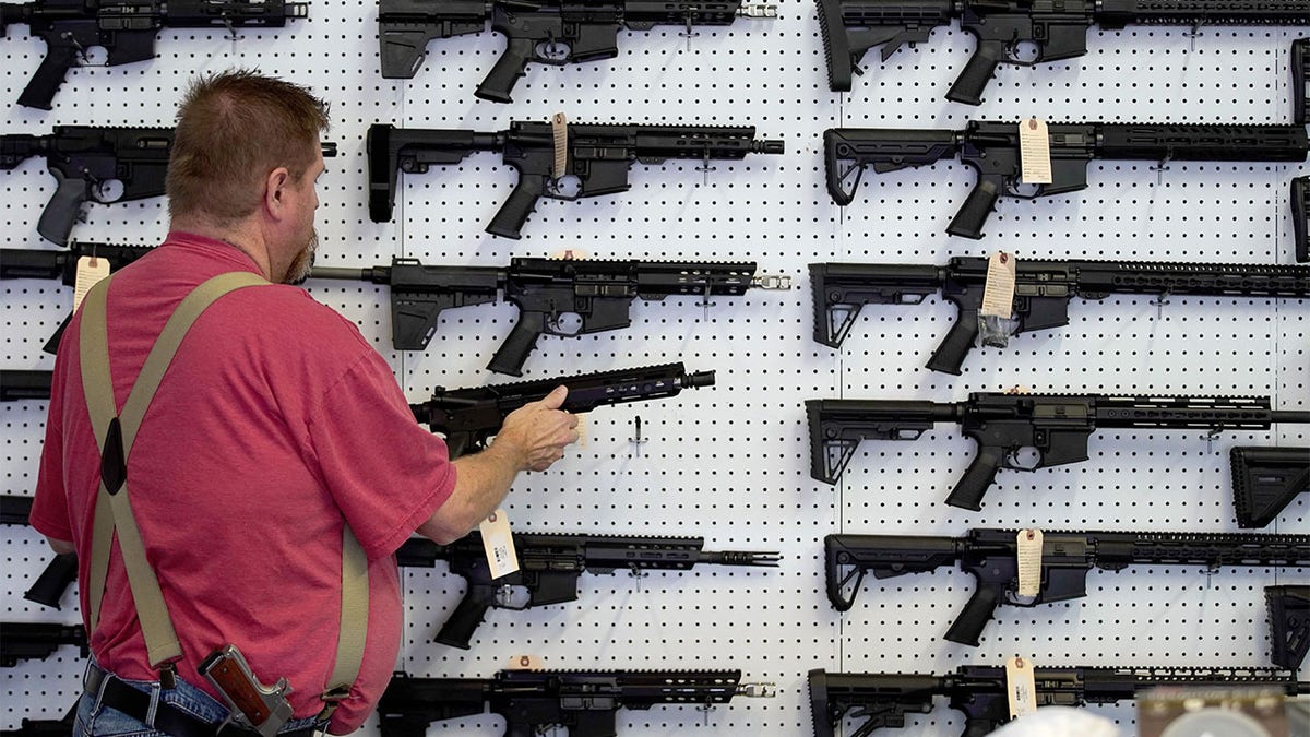 Rifles on wall of gun store in Utah