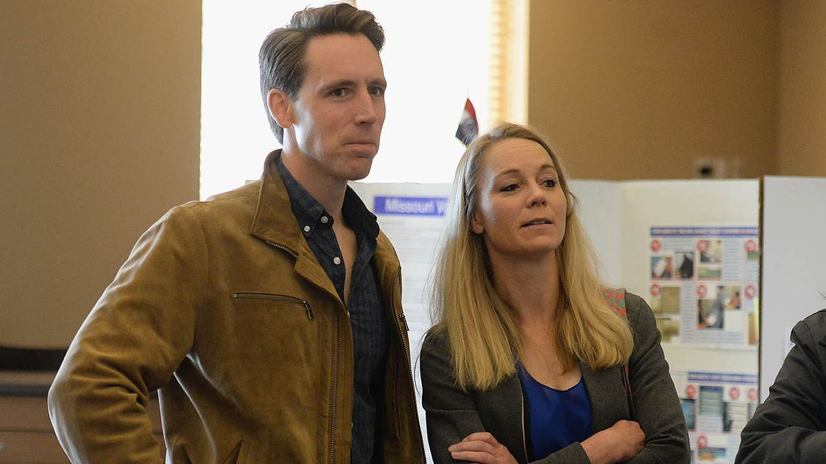COLUMBIA, MO - NOVEMBER 06: Missouri's Republican U.S. Senate Candidate Josh Hawley waits in line with his wife, Erin Hawley, to casts their votes on election day at The Crossings Church on November 6, 2018 in Columbia, Missouri. Hawley, the current Missouri Attorney General, is hoping to unseat current Democratic incumbent Senator Claire McCaskill. (Photo by Michael Thomas/Getty Images)
