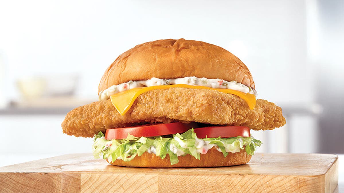 Arby’s King's Hawaiian Fish Deluxe sandwich is beefed up with iceberg lettuce, tomatoes, cheese and tartar sauce on a King Hawaiian bun.