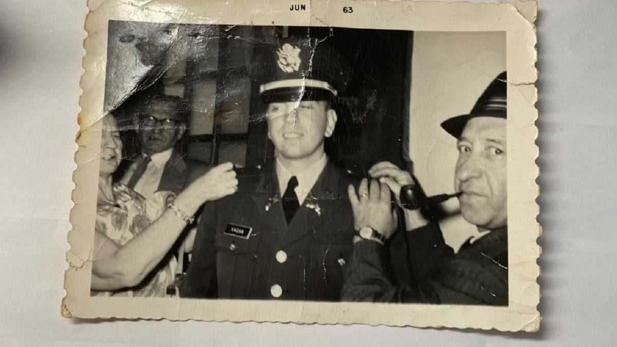 Seymour Kagan's mother and father pin his second liutentant bars on his uniform following his graduation from Rutgers University's ROTC program in 1963. His uncle, in the background, looks on. (Courtesy Seymour Kagan)