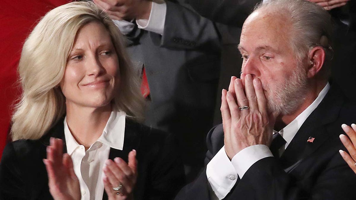 Kathryn Limbaugh applauds as her husband, Rush Limbaugh, receives the Presidential Medal of Freedom on Feb. 4, 2020.