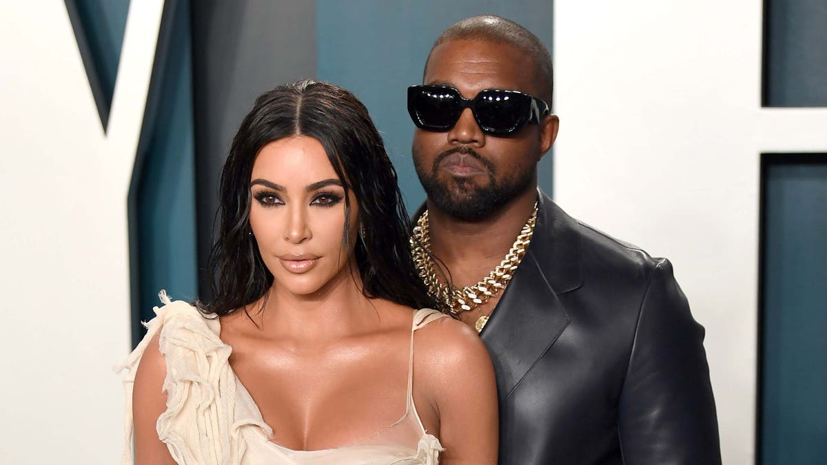 Kim Kardashian (left) and Kanye West (right) and in the midst of a reproted divorce. (Photo by Karwai Tang/Getty Images)