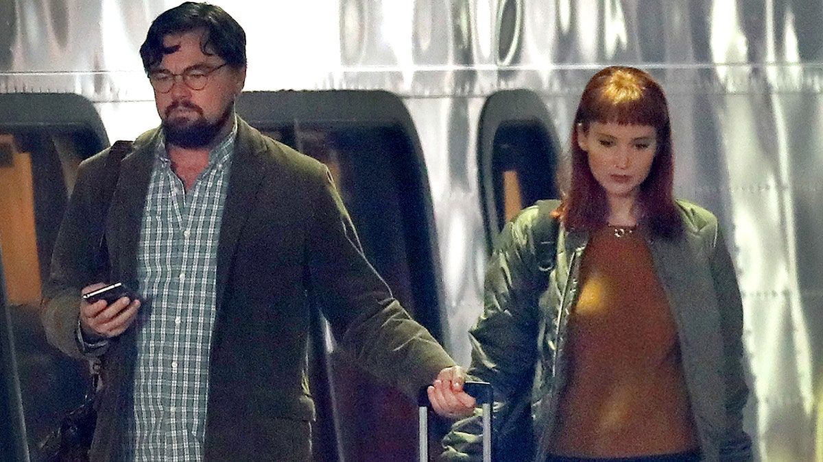 Leonardo DiCaprio (left) and Jennifer Lawrence (right) on the set of the upcoming Netflix film 'Don't Look Up.' (Getty Images)