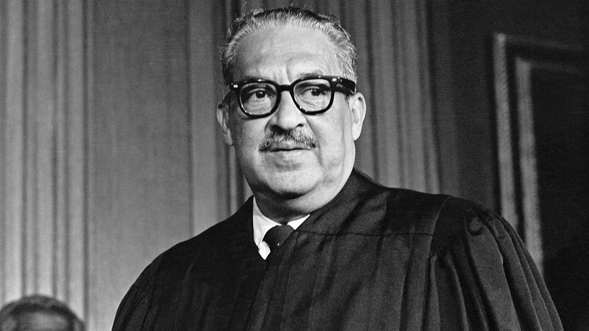 Thurgood Marshall, the great-grandson of a slave, takes his seat as the first black member of the United States Supreme Court.